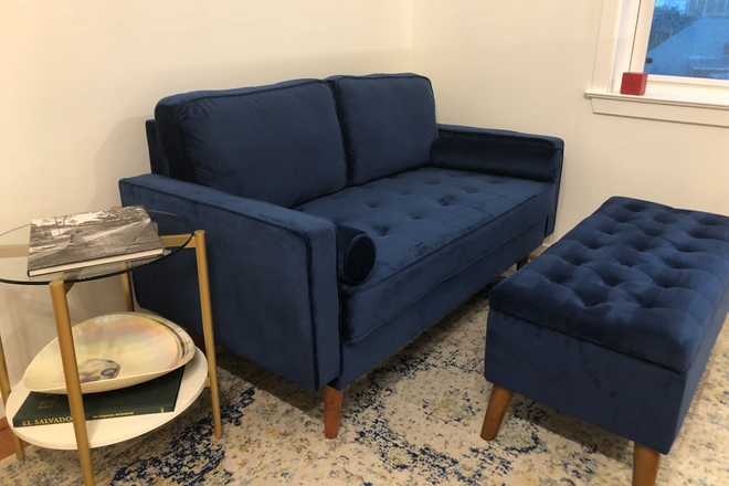 Small love-seat and side table. - 1BR Corner Unit in Columbia Heights, Private Parking Included (15 min walk to Howard) Condo