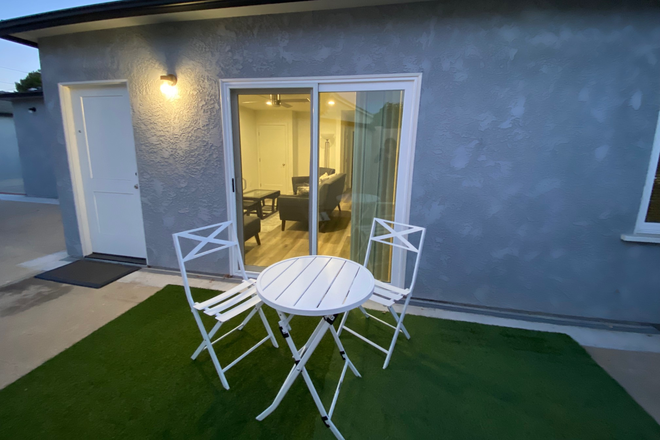 Cottage Exterior with private front patio area. - Newly built back house with shared yard, quiet neighborhood. Walking distance from Chapman.