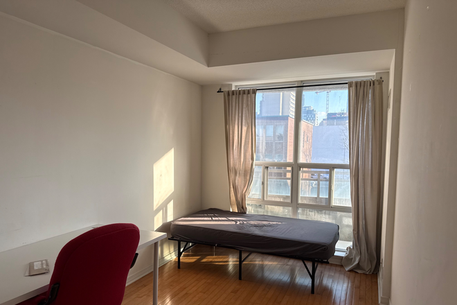 Master Bedroom - 1 Bedroom and 1 Den Available in furnished Apartment steps from Downtown Campus