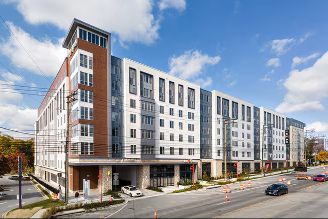 Building Picture Entrance to the parking space is where the white car is pictured - Tempo College Park