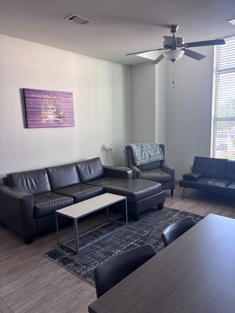 The shared family room - The Boundary at West End Apartments