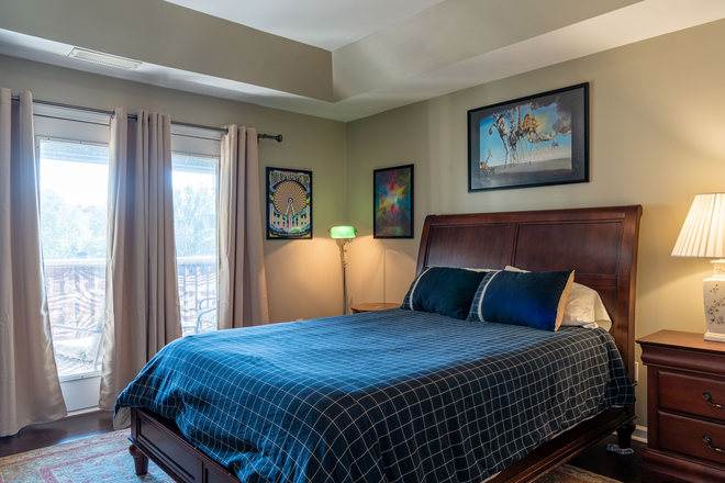 Bedroom - Spacious two-story home (1459 sqft total) with double floor-to-ceiling windows.