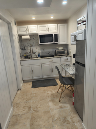 hot plate, micrwave, toaster, sink, Garbage disposal, table - Basement-suite, centennial-greenwood village