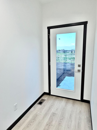 Backdoor to concrete patio and large back yard - Duplex near the nature park Duplex