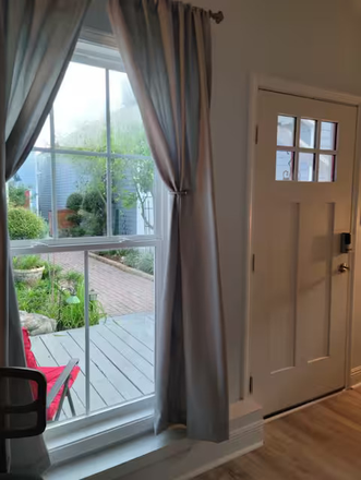 Living Room Window View - Furnished Uptown 1 bedroom /Rent Inclusive Utility, Furnishings, Gardening, Pest Control Apartments