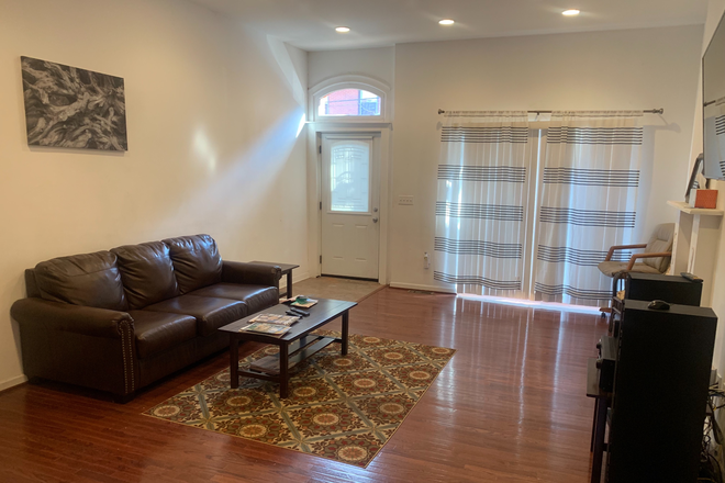 Living Room - 3BR en-suite Furnished Town-House with Rooftop Deck. Utilities & Parking Included. Walk to Campus