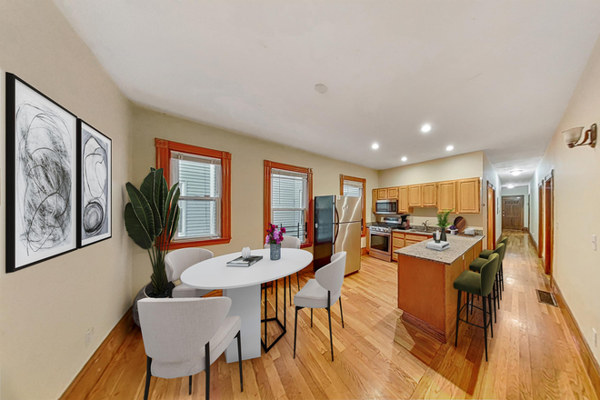 Updated kitchen with stainless steal appliances. Full size fridge/ freezer. Built-in microwave. Dishwasher. Stove and range. - Awesome 4 bed/ 1 bath in Mission Hill Triplex