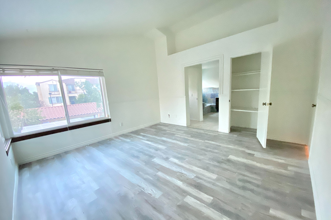 Spacious master bedroom with big linen closet - 1 Master Bedroom and 3 Individual Bedrooms in a Renovated 4/2 House in a Nice Neighborhood