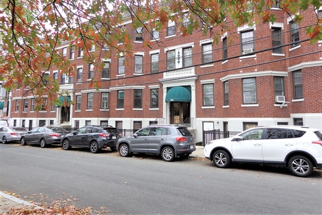 Visit hubrealtyproperties.com - Handy top floor studio in condominium building, great location next to green line T