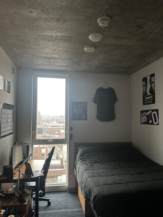 Bedroom photo facing window - “1 Furnished Bedroom in 4-Bedroom Unit CampusOne - All Utilities Included”