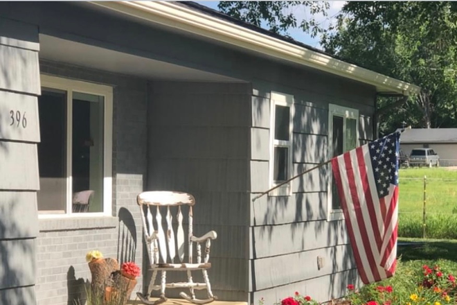 front of the house facting 76th St. and mountains - House for rent on horse facility. East Boulder. Can trade ranch chores/rent