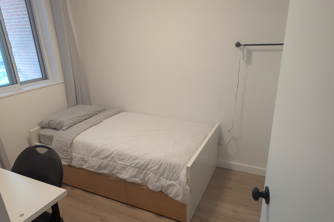 View of the room from the doorway - One bedroom with built in closet, Furnished with single bed and desk. Single occupancy