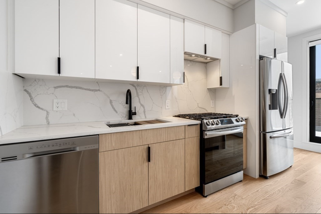Kitchen - 2 bed/2 bath walk to Red Line stop - Features garage parking, gym, in-unit laundry, and balcony.