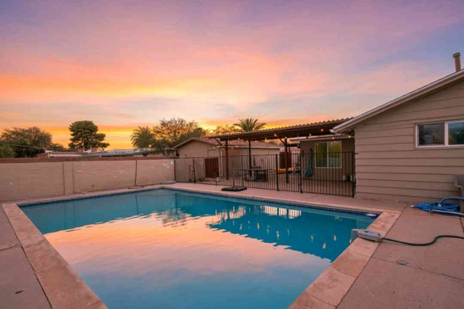 Pool and patio during sunset - Private Room Near UofA – Month-to-Month, Backyard Pool & Full Amenities!