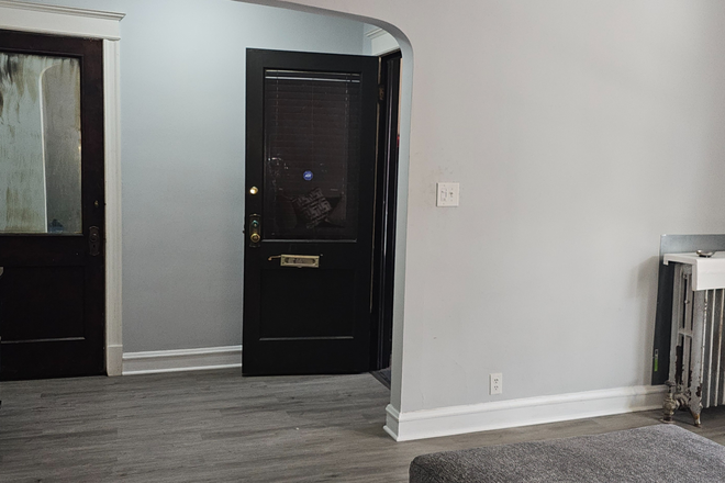 Family room view from front - Modern Furnished 2BR Near UIC | Utilities Included + Garage Parking