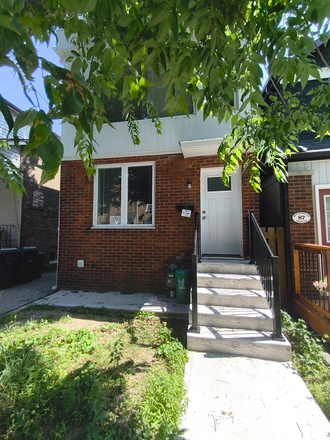 House front - Furnished 3-Bed, 1.5-Bath New-build Home in Danforth Village - Steps to Greenwood Stn, Util Incl