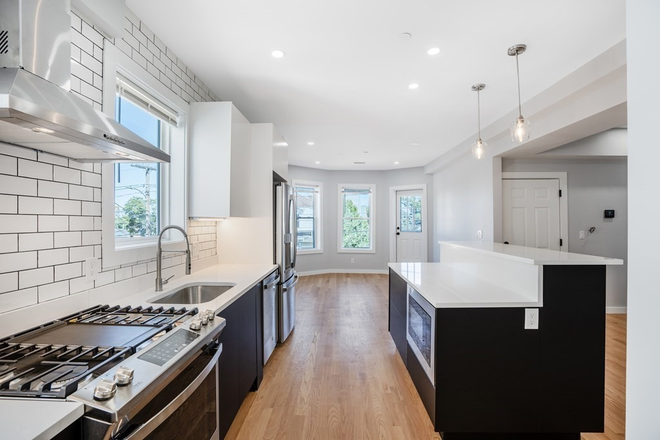 kitchen - Gut renovated 4 bed/3 bath with in unit laundry and deck - NO FEE! Apartments