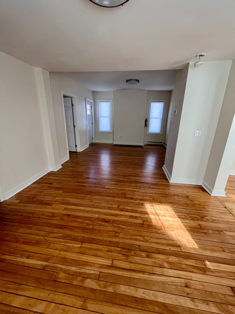 Living area looking towards entry - 3 BR Apt, totally renovated house, close to campus, hospital & downtown