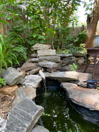 solar fountain in landscaped garden - 3 BR, central AC, one bath duplex Apartments