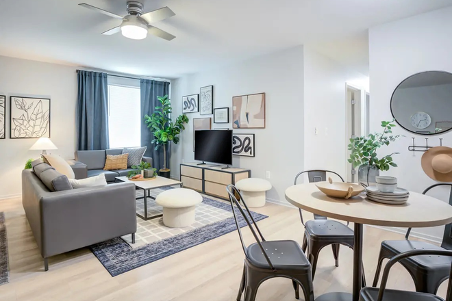 Living room and table - Yugo Skybox: 4 bed 2.5 Bath, close to campus! Apartments