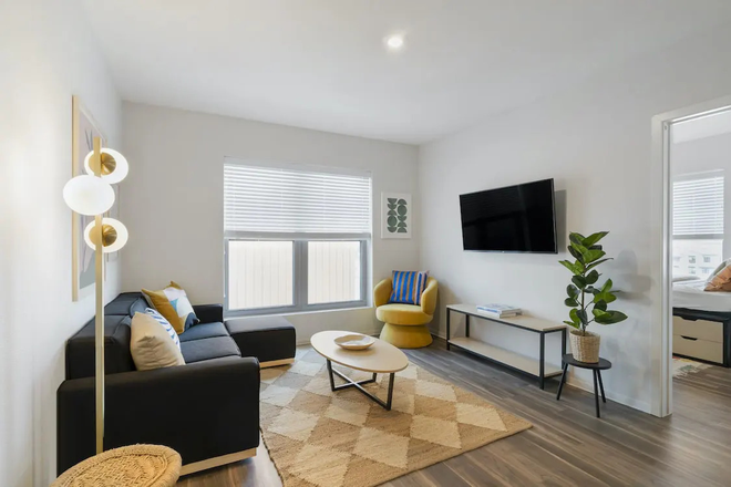 Living Room - Furnished 1BR Near BART