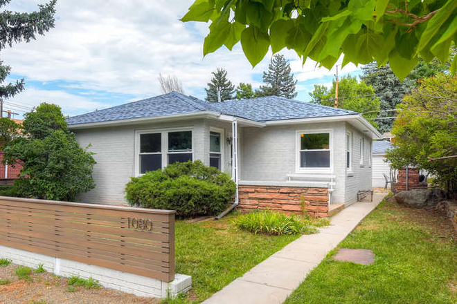 The attractive front view of the property, with partially fenced front yard - 3 bed/2 bath home 6 blocks from CU campus