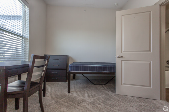 Bedroom with window - Furnished Room at The Lofts at Wolf Pen Creek