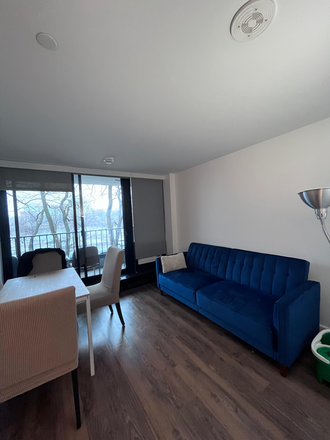 Shared living room with balcony - Winter Sublet: One Bedroom in a 3BHK at Harvard Business School campus (Soldiers Field Park) Apartments