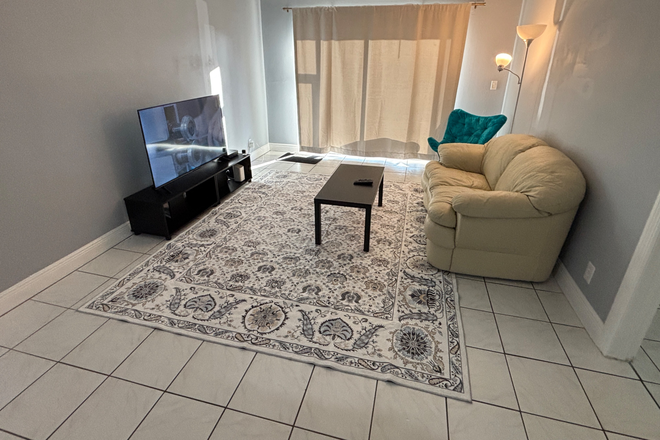 Living room with 55” tv - Furnished Ground Floor Room w/Private bathroom– Walk to FAU Condo