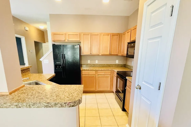 Kitchen with appliances. - Kiskadee Park, under 5 miles from CCU Townhome
