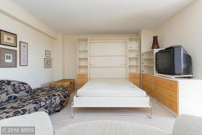 Murphy bed opened out - Elegant, spacious studio at Georgetown / Dupont nexus Condo
