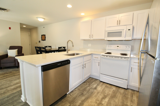 Kitchen - Campus View! Remodeled 4 BR - 4 BTH condo! Now Pre Leasing for the 2025-2026 school year!