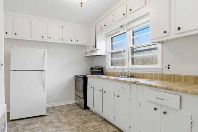 Kitchen 1 - 2-BR apartment minutes from campus, Wal-mart, Starbucks: water, lawncare, trash pickup include