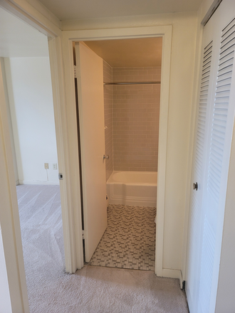 Entrance looking at the bathroom and bedroom - Devon Towers Apartments