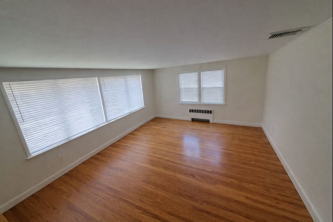 Living Room - Spacious 4BR/2Bath Home Near Brandeis & Bentley – Parking, Yard, Deck, In-Unit Laundry