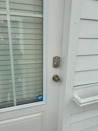 Doorway entry w/ code lock - FROG-PARTIALLY FURNISHED Apartments