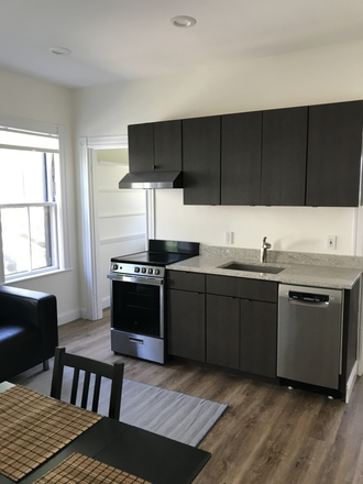 full kitchen - Bright, Garden-level Furnished Studio Rental near Harvard Observatory Duplex