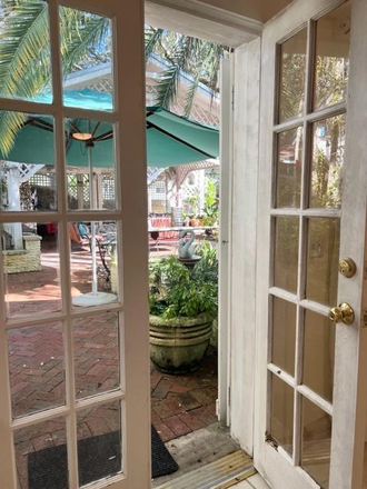 View of patio from the cottage - Quiet, charming private COTTAGE      Close to Campus     1 bedroom/ bath   Gated private residence
