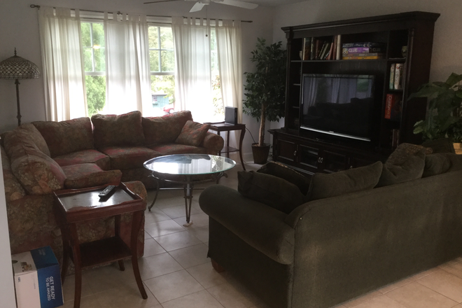 Large furnished living room, open to kitchen and dining. - 45 Allagash Trail Narragansett, RI 02882 House