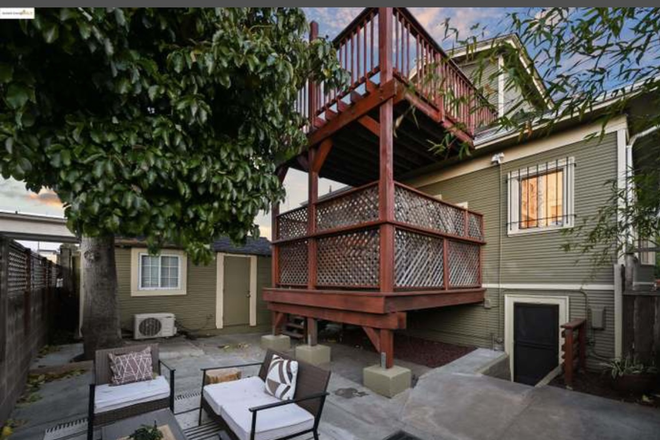 Backyard and upper & lower deck - Large 3 Level House with Multiple Living Areas