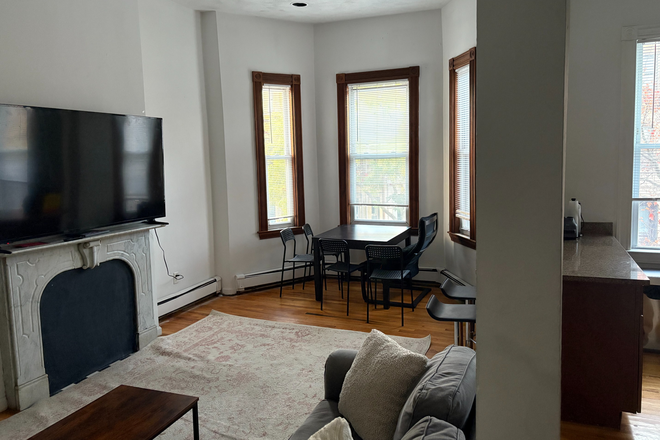 Living room - (Next to Brigham Circle Stop) 14 Wigglesworth St One Bedroom Sublet Apartments