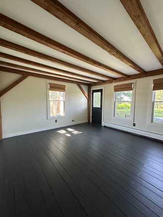 Main floor bedroom with its own deck space and entrance to the backyard - Private & Spacious Upstairs Bedrooms in a Recently Remodeled Luxury Farmhouse 1.9 Miles t