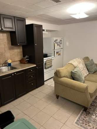Living Room/Kitchen - Bright 1-Bedroom in Baldwin Village | All Utilities Included | Townhome