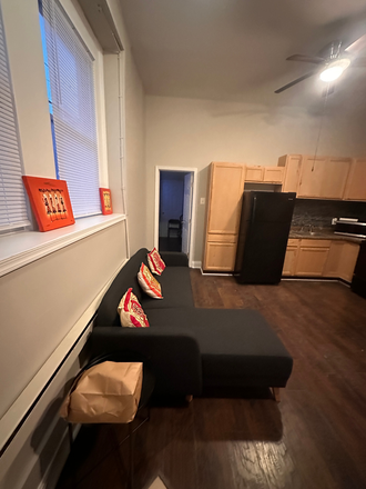 sectional couch in living room - 1BR Furnished Unit | S. Philly & Center City | Utilities-WiFi Included | $1450/mo | Flex lease terms Apartments