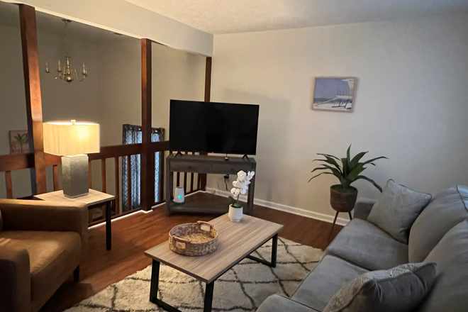 Cozy living room with 50 in smart TV. Own floor plan - Furnished with all utilities 3bedroom Townhouse