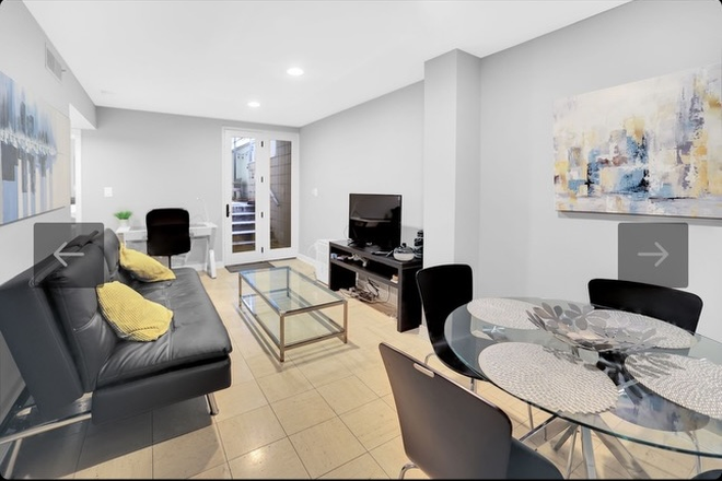 Living Room - Furnished 1BR/1BA Sunny Apt with back yard, W/D