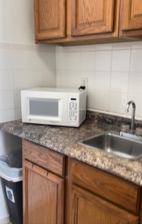 Kitchen - Home with separate Two level apartment 1bed 2 baths in quiet neighborhood 2-3 miles from campus.