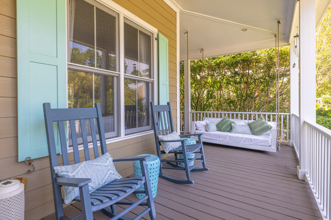Wrap around porch and swing - Beautifully Designed Low Country Home – Effortless Single-Level Living Just 20 Minutes from MUSC