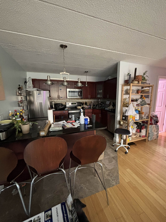 Kitchen and bar area (no dining room) - Apartment right off of Medford Square, 30 min walk to campus, AC and heat included