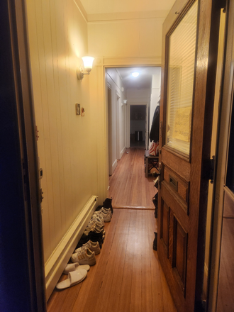 hallway view from front door (kitchen is at the end) - 2Bed/1Bath house with in-unit laundry (1 ROOM FOR RENT) **Cats**